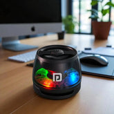 Black cylindrical device with colorful LED lights on a desk